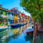 The unique, colorful houses of Burano overlook the canal